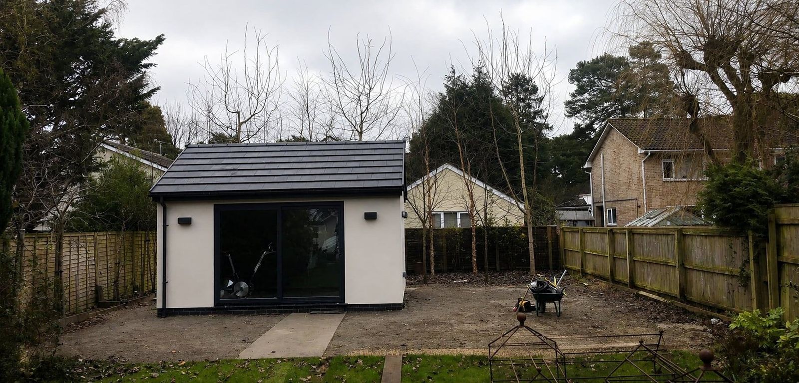 Before: bare ground around a new garden room, ready for patio and turf, Dorset