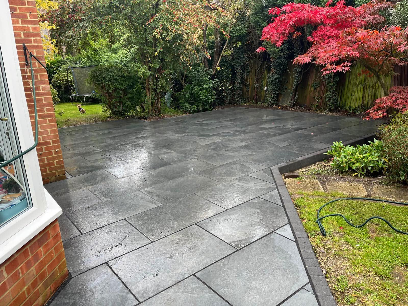 100 sqm dark grey porcelain patio wrapping around a conservatory at Avon Castle