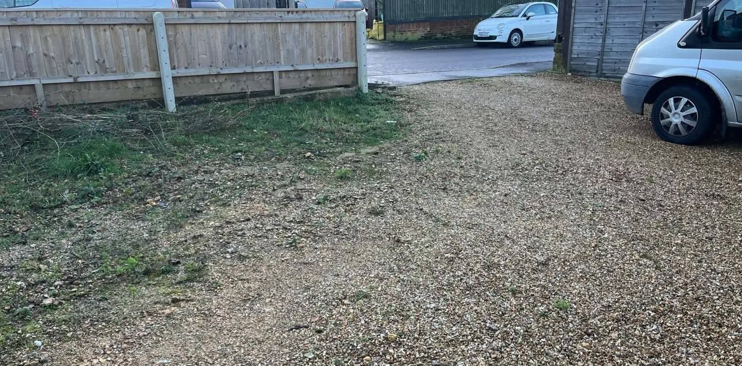 Before: weedy, worn gravel frontage before the new driveway